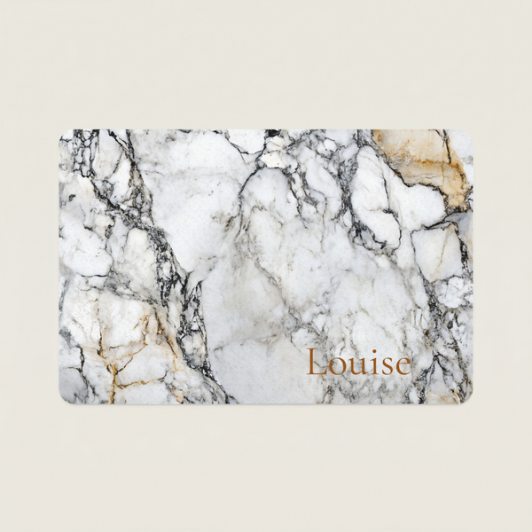 Marble-patterned dog food mat with 'Louise' text on a beige background