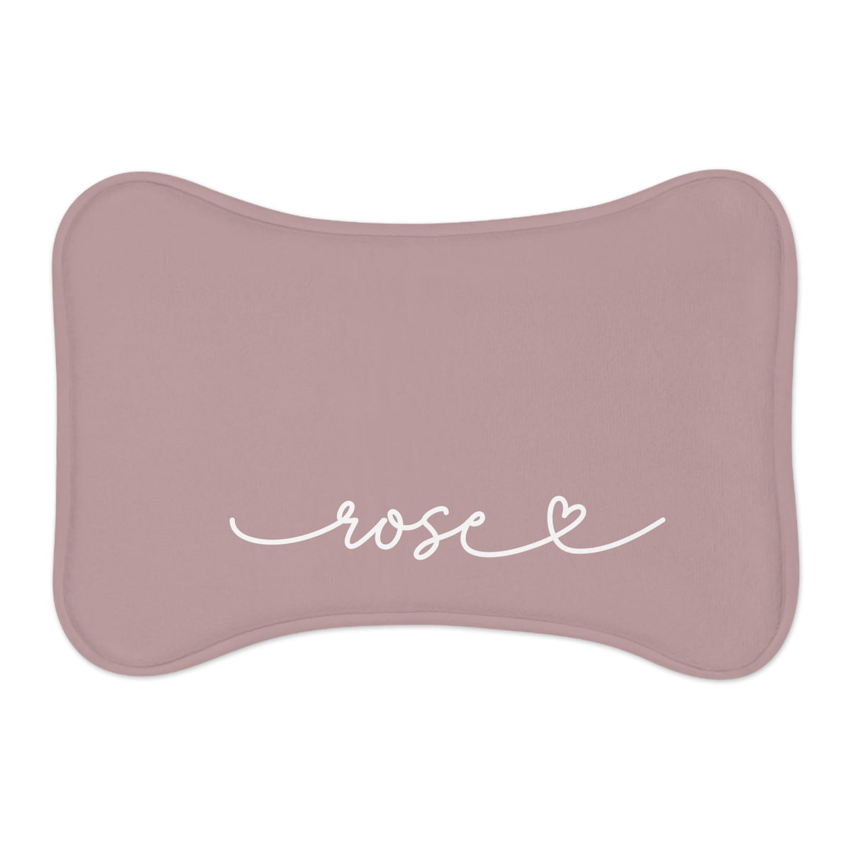 Dusty rose bone-shaped personalized pet food mat with a name in white script