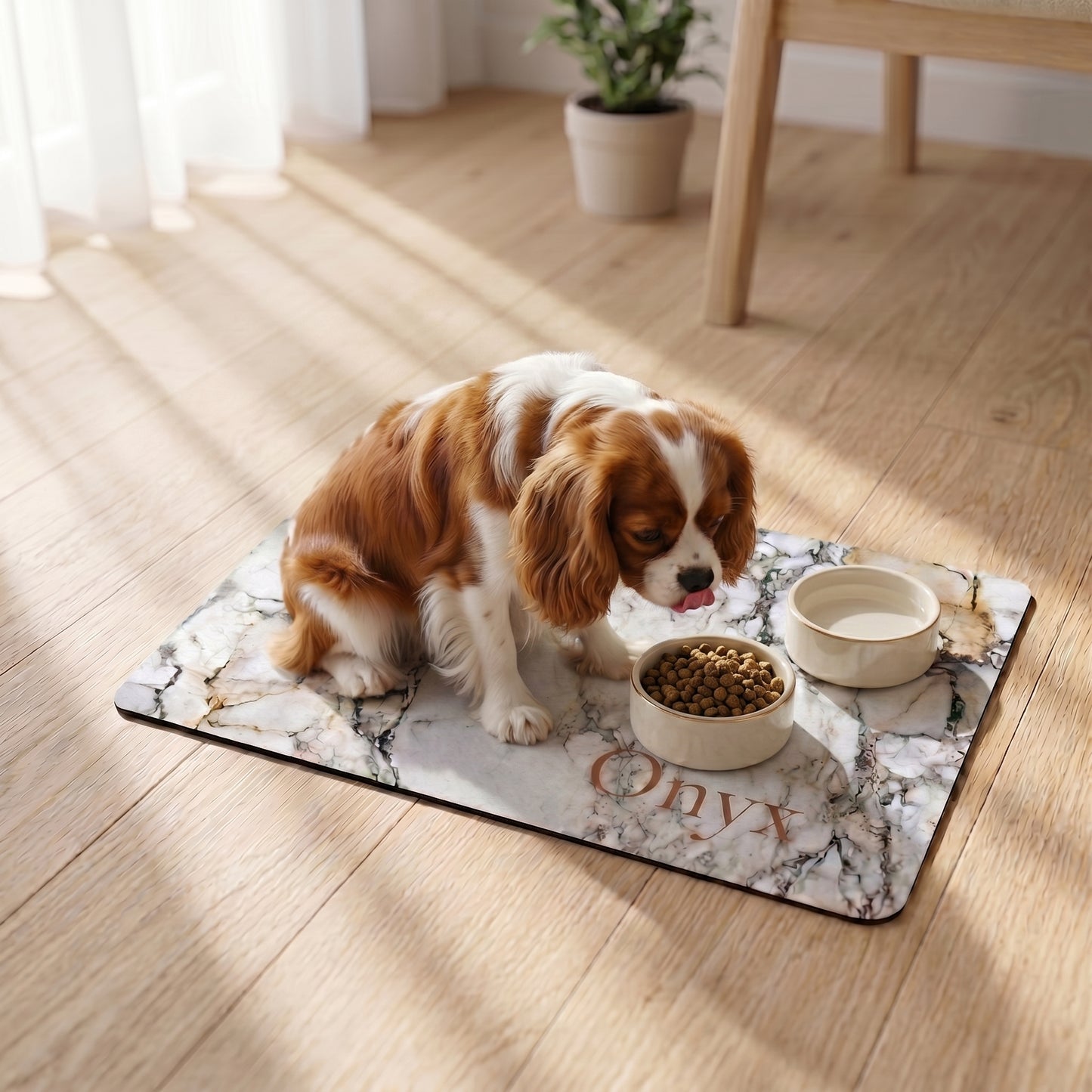 Dog eating from a bowl on a marble-patterned dog bowl mat with 'Onyx' branding in a home setting.