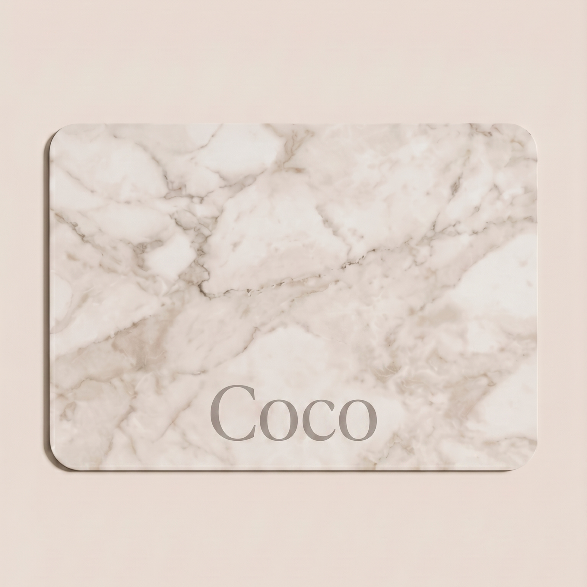 Marble-patterned card with 'Coco' text on a beige background