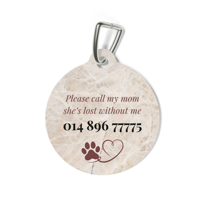 Back of the beige marble pet tag with printed contact message, a paw print and a heart