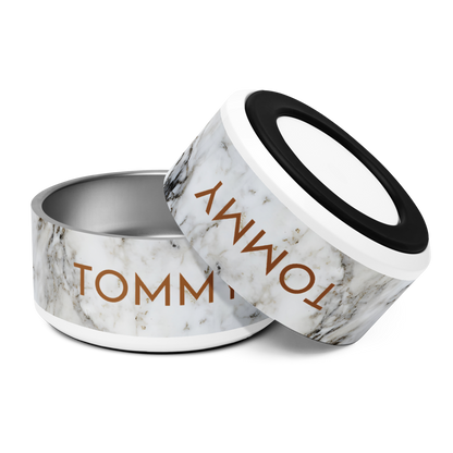 Pair of black and gold marble personalized stainless steel dog bowls with the name Tommy, tilted view
