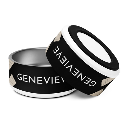 Two large black biscuit personalized dog bowls with the name Genevieve, one tilted to show the rim