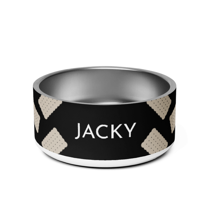 Black biscuit personalized stainless steel dog bowl with the name Jacky in white capitals between sand scalloped cookies