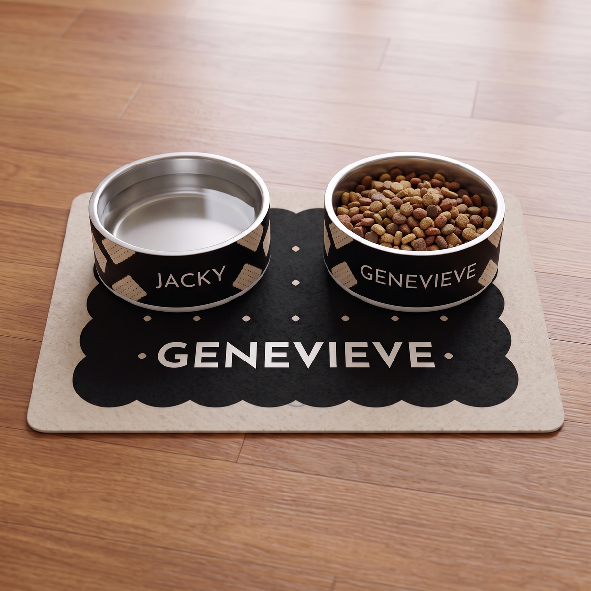 Two black biscuit personalized dog bowls on the matching black biscuit dog food mat with the name Genevieve