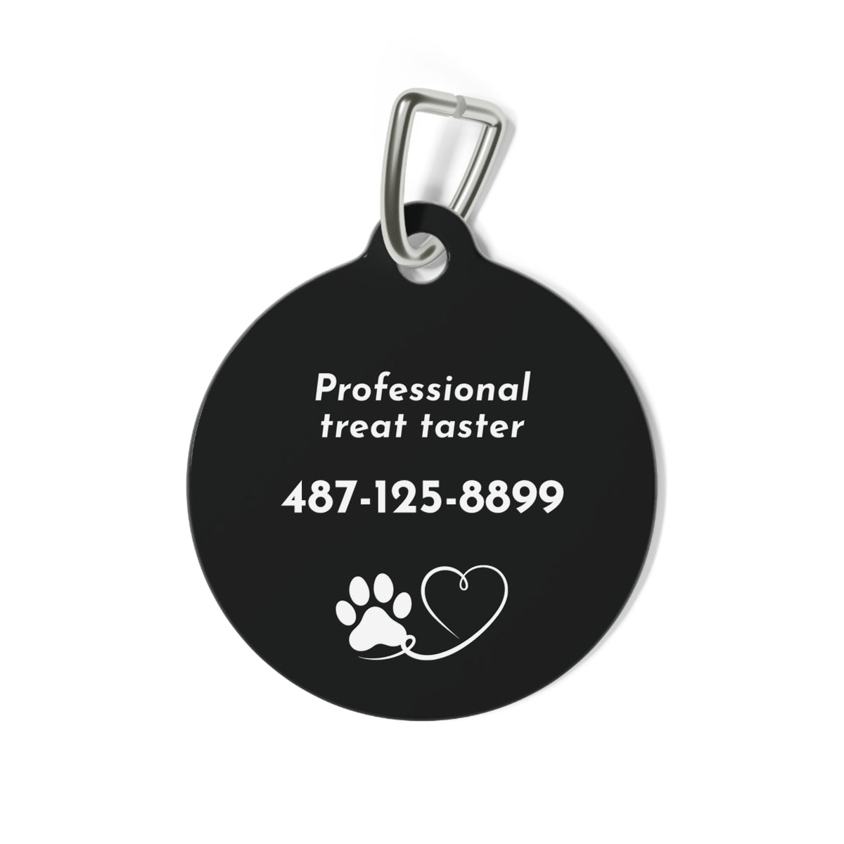 Back of black biscuit personalized dog tag with Professional treat taster, phone number and a paw and heart