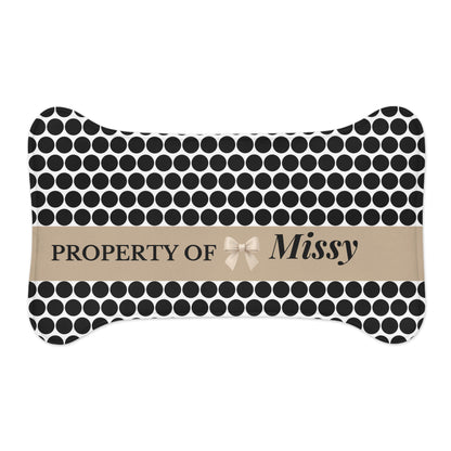 Small black polka dot bone-shaped personalized pet feeding mat with the name Missy
