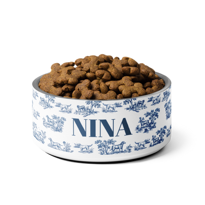 Blue toile personalized dog bowl with the name Nina filled to the brim with kibble