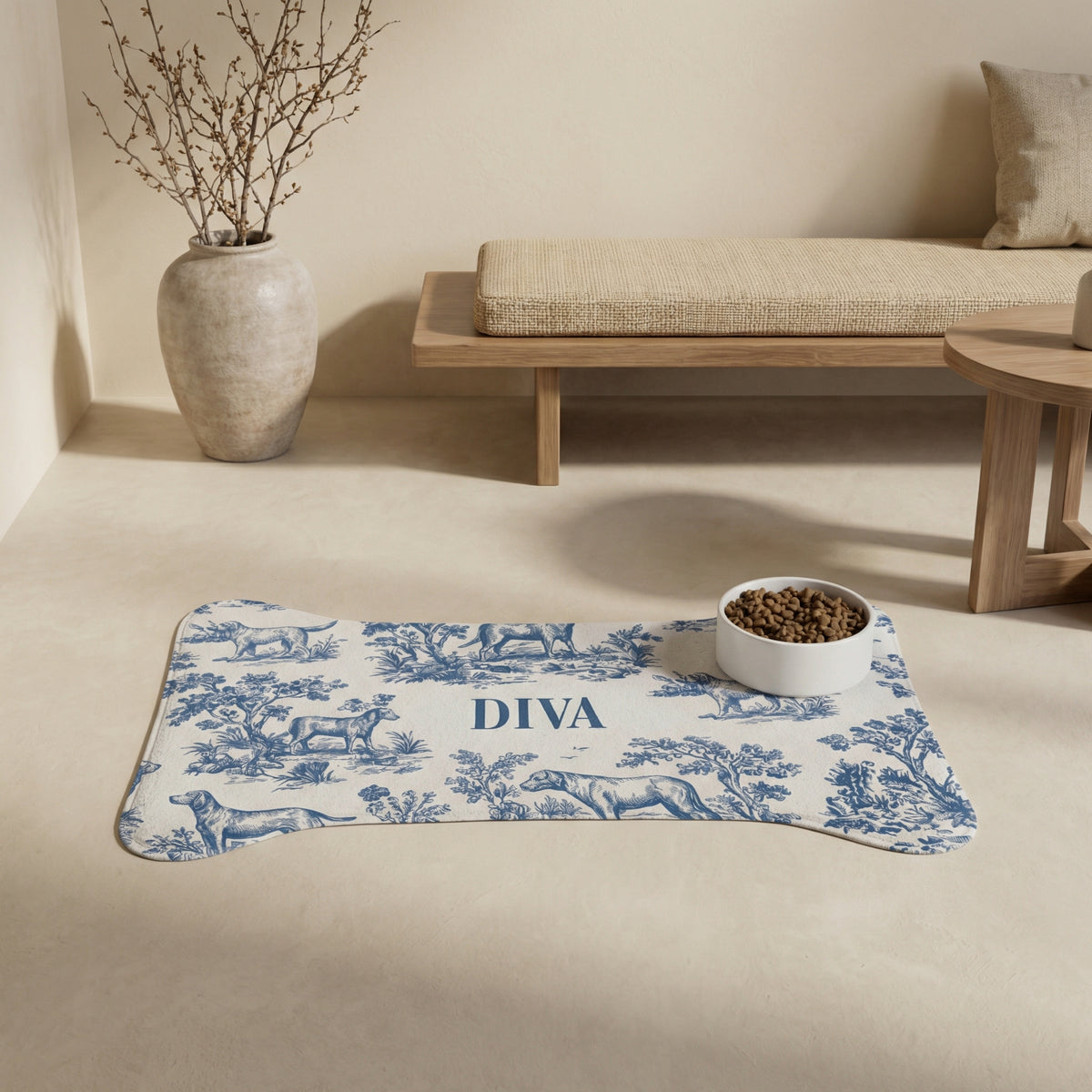 Blue toile bone-shaped personalized pet feeding mat with a bowl in a calm neutral living room