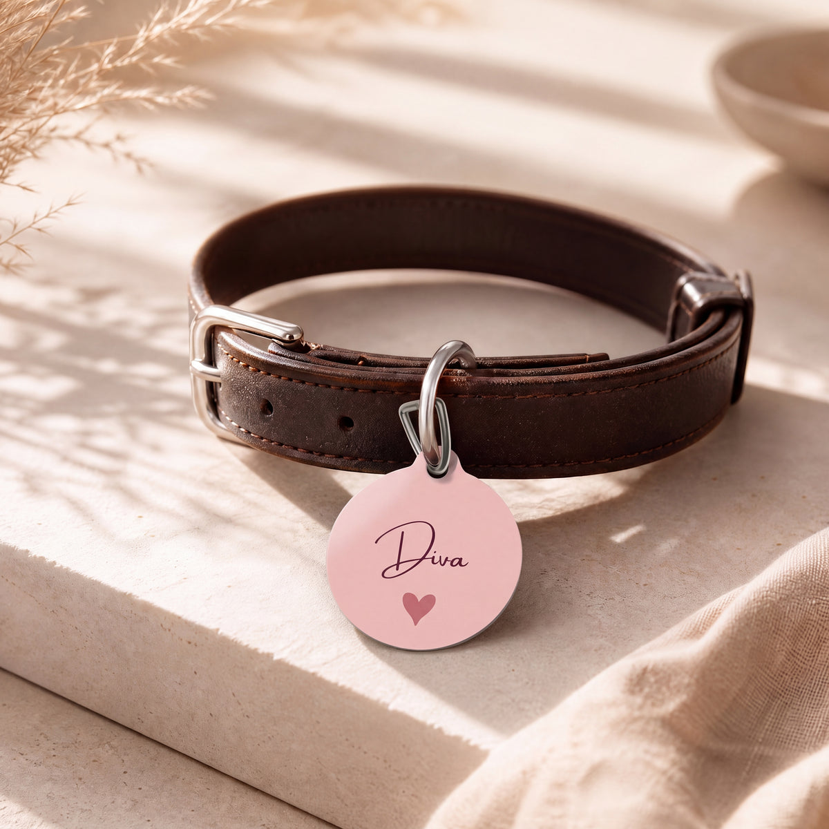 Blush heart pet tag on a dark brown leather collar