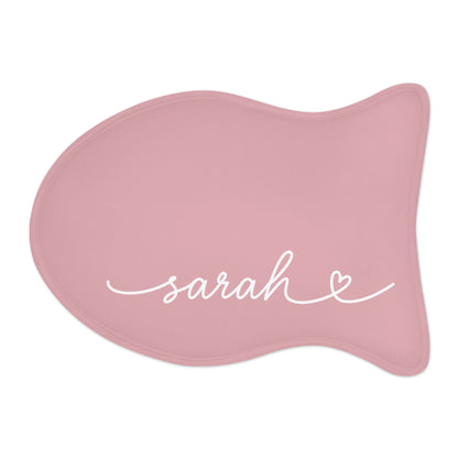 Blush pink fish-shaped personalized pet feeding mat with the name Sarah in white handwritten script
