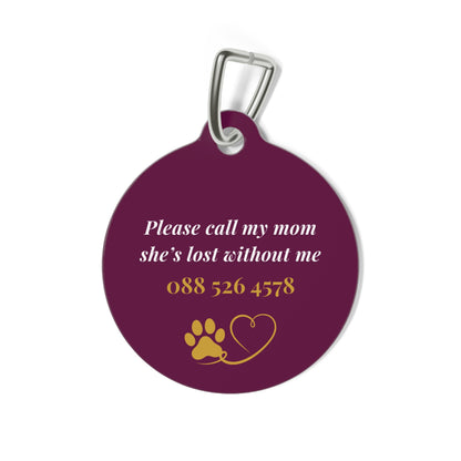 Back of the burgundy crown pet tag with phone number and paw heart
