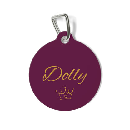 Burgundy crown personalized pet tag with the name Dolly in gold script and a small gold crown