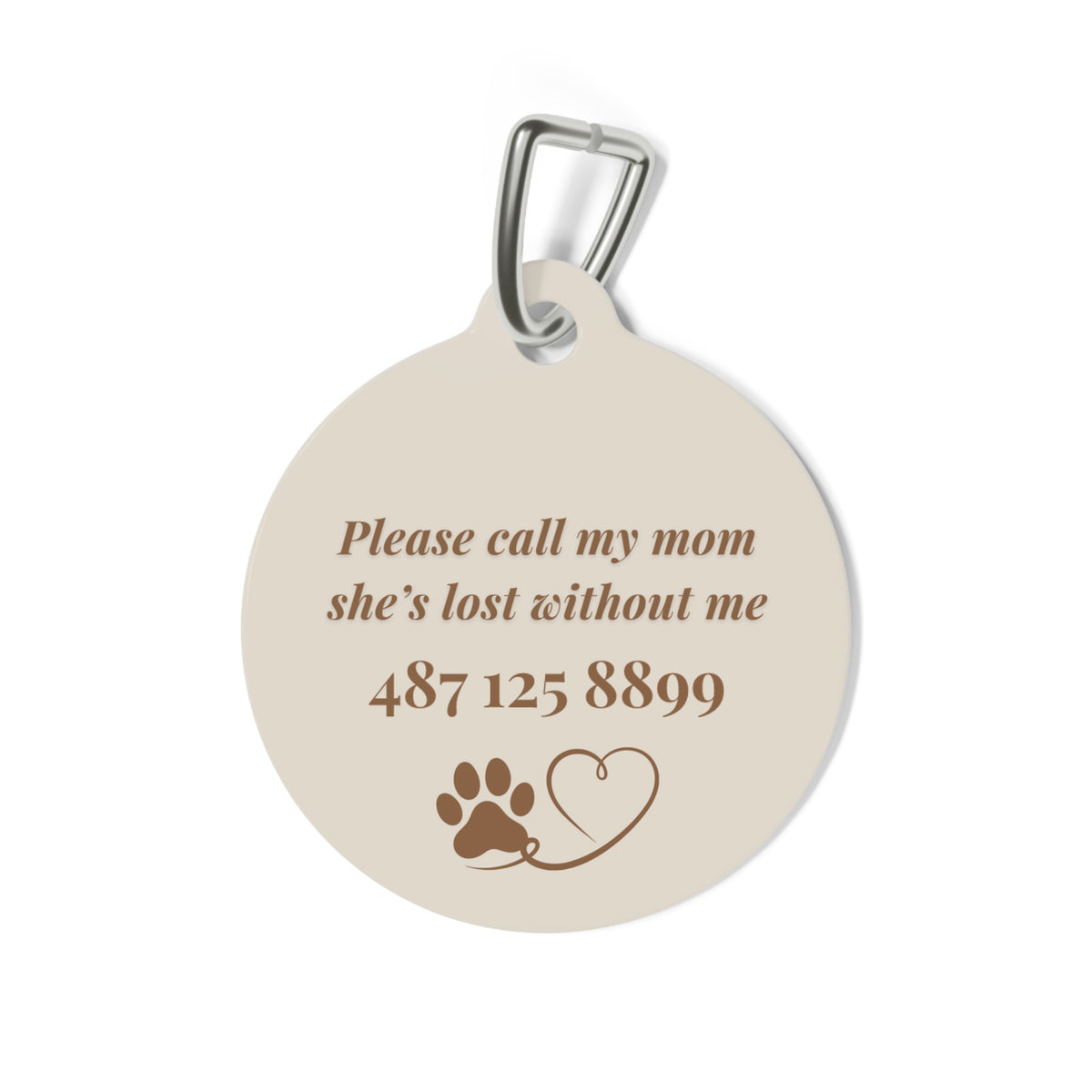 Back of the croissant pet tag with printed contact message, a paw print and a heart