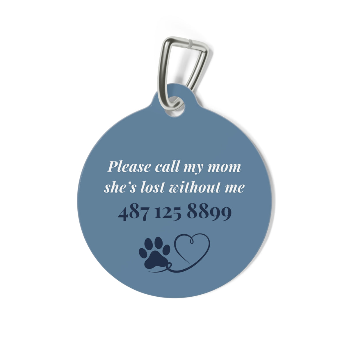 Back of the denim blue pet tag with printed contact message and a paw print