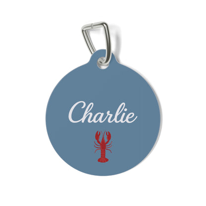 Denim blue personalized pet tag with the name Charlie in white script and a red lobster