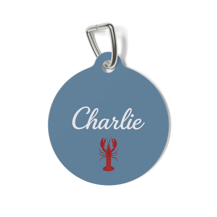 Denim blue personalized pet tag with the name Charlie in white script and a red lobster