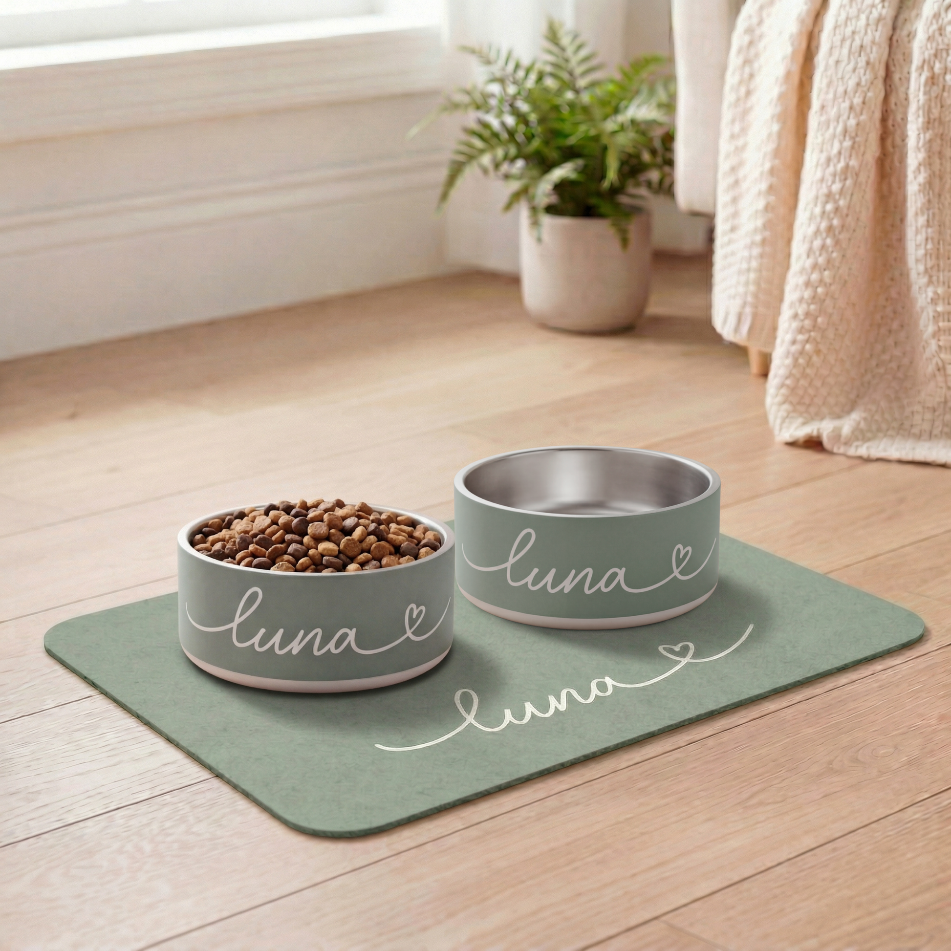 Two pet bowls labeled 'Luna' on a mat with food inside, in a home setting.