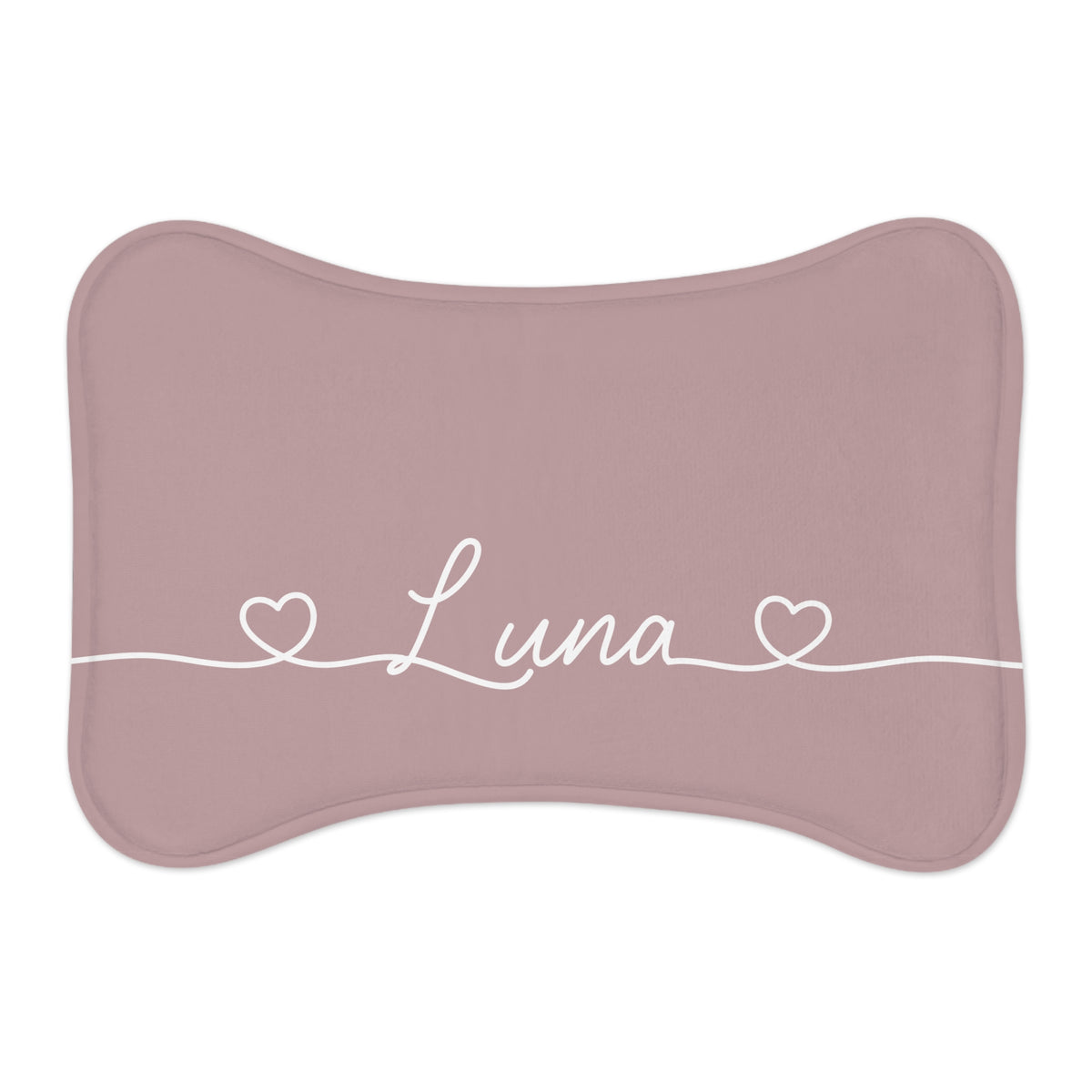Dusty rose bone-shaped personalized pet feeding mat with the name Luna in white script between two small hearts