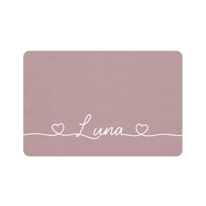 Dusty rose rectangle personalized pet food mat with the name Luna in white script between two small hearts