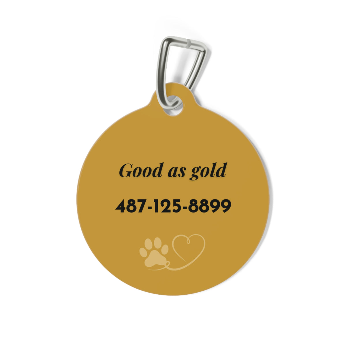 Back of the gold paw print dog tag with the funny text Good as gold and a phone number