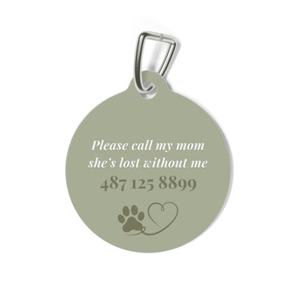 Back of the sage green heart pet tag with phone number and paw heart