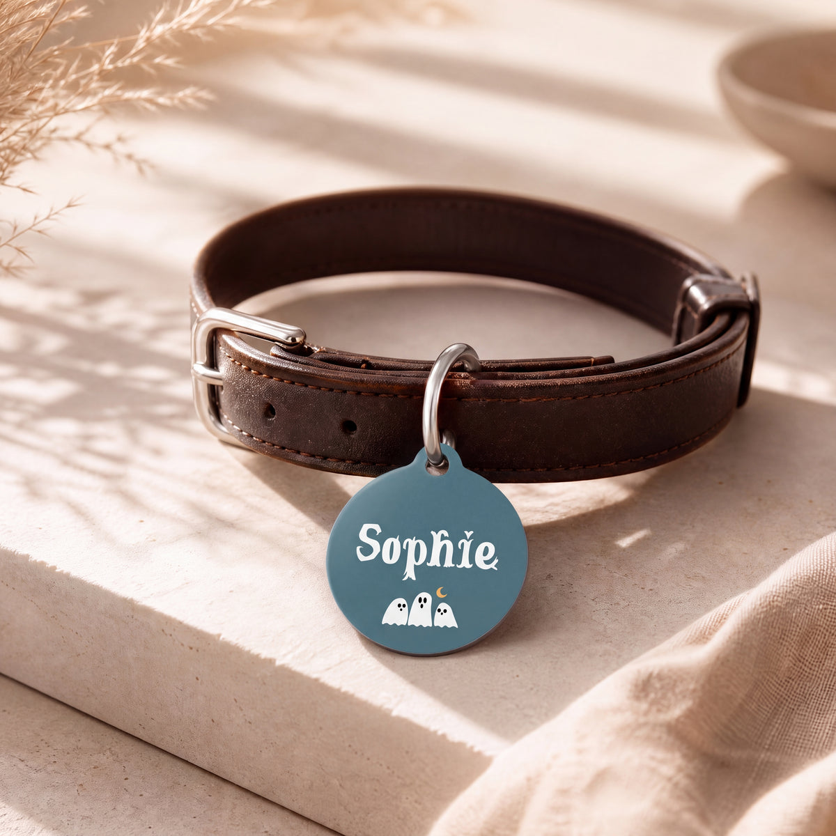 Halloween ghost pet tag on a dark brown leather collar