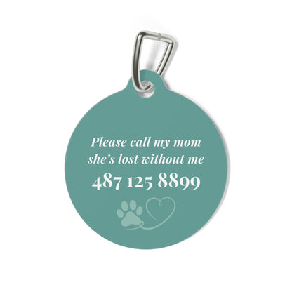 Back of the jade green personalized pet tag with a contact message, phone number and paw print with heart