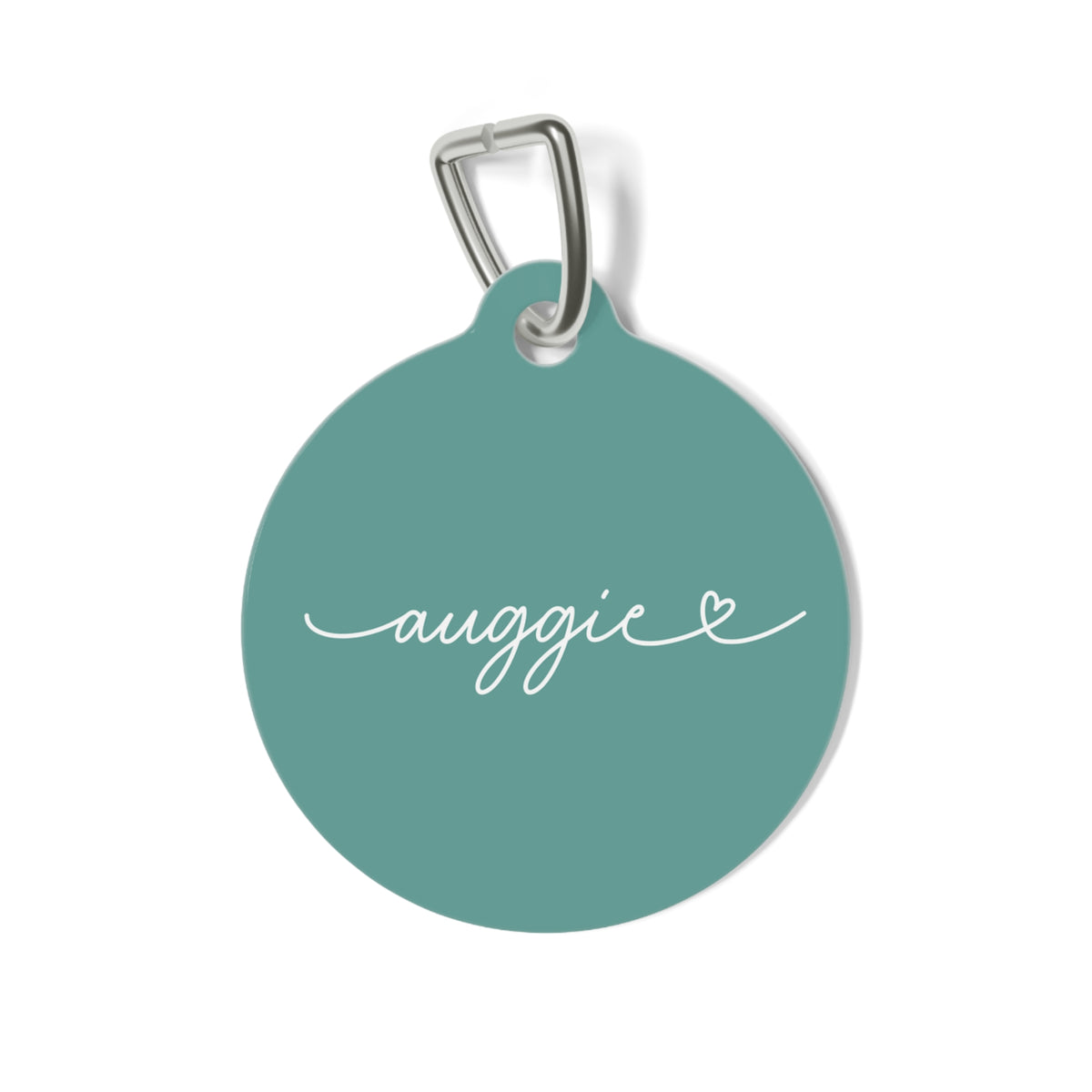 Round jade green personalized pet tag with the name Auggie in white handwritten script and a small heart