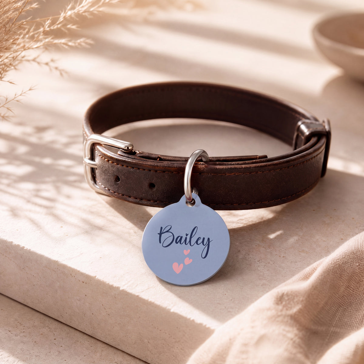 Lavender heart pet tag on a dark brown leather collar