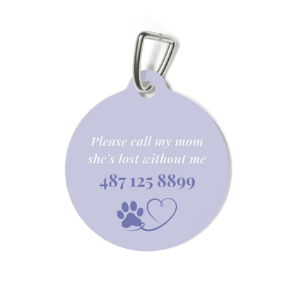 Back of the lavender pet tag with printed contact message, a paw print and a heart