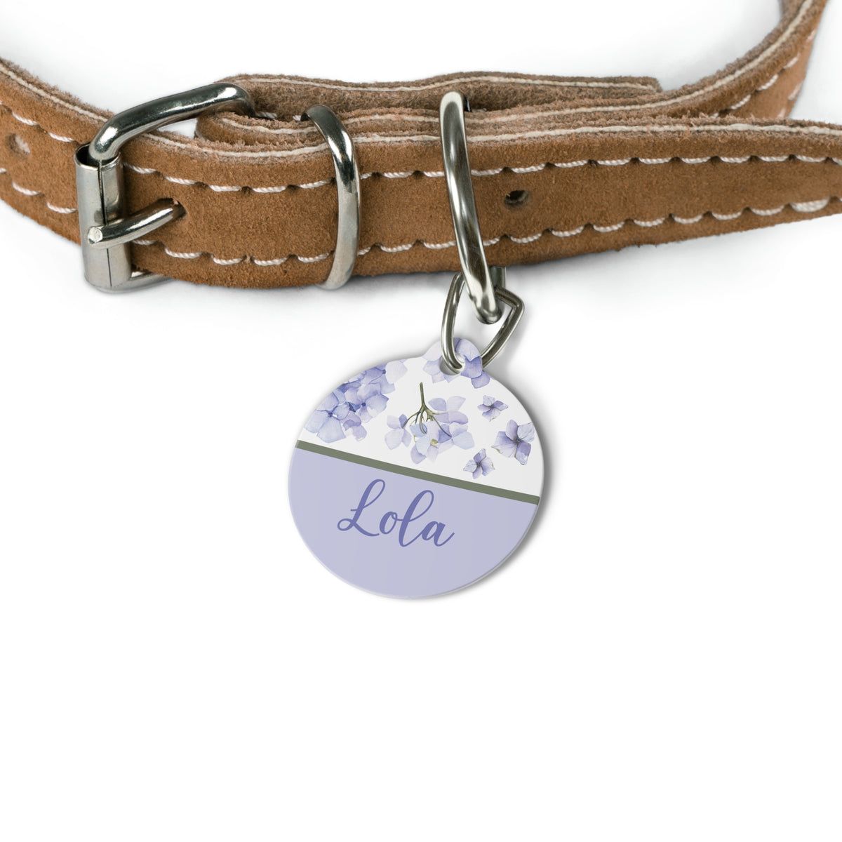 Lavender hydrangea pet tag attached to a tan leather dog collar