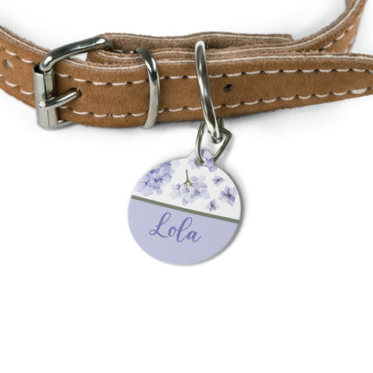 Lavender hydrangea pet tag attached to a tan leather dog collar