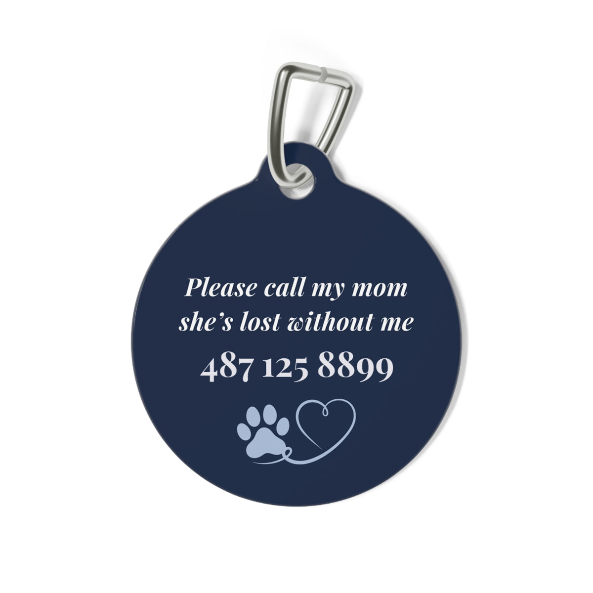 Back of the navy pet tag with printed contact message and a paw print
