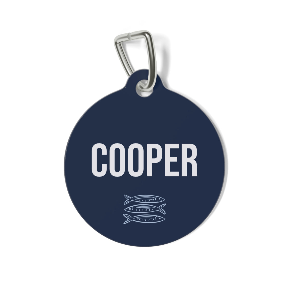 Navy blue personalized pet tag with the name Cooper in white block letters and a small sardine