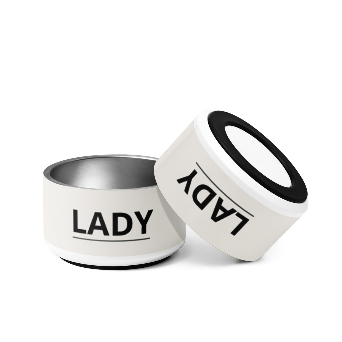 Two off-white modern personalized dog bowls with the name Lady, one tilted to show the rim