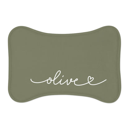 Olive green bone-shaped personalized pet feeding mat with the name Olive in white handwritten script and a small heart