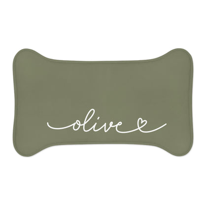 Small olive green bone-shaped personalized pet feeding mat with the name Olive in white script