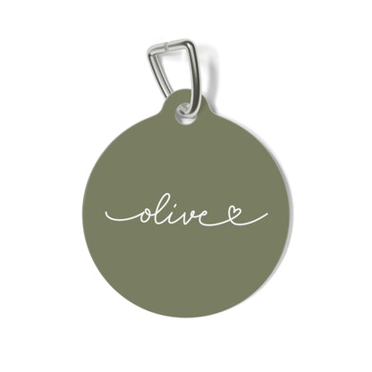Round olive green personalized pet tag with the name Olive in white handwritten script and a small heart