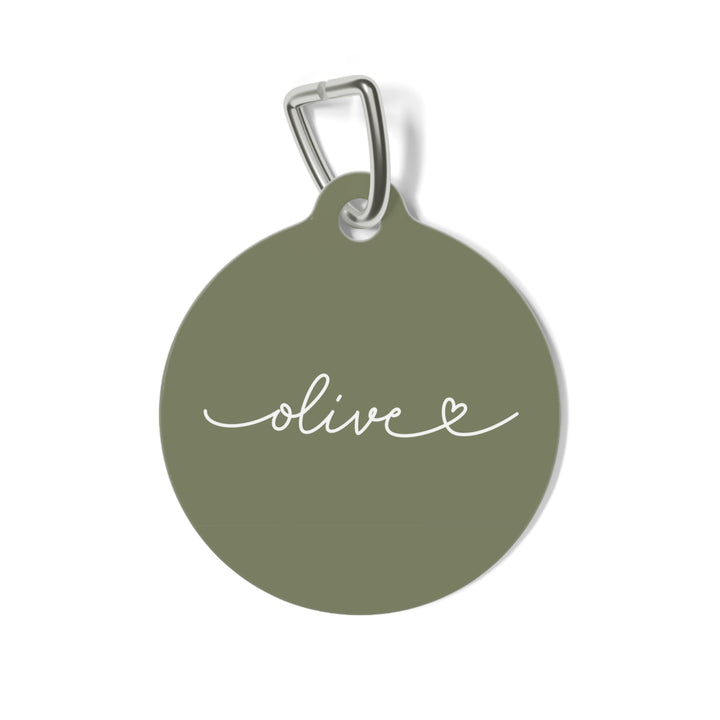 Round olive green personalized pet tag with the name Olive in white handwritten script and a small heart