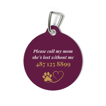 Back of the burgundy clover pet tag showing the contact message with paw and heart icons