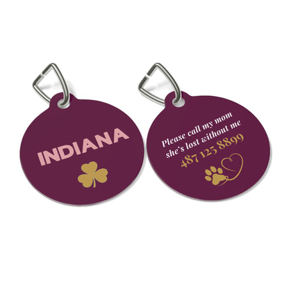 Front and back of the burgundy clover personalized pet tag shown side by side