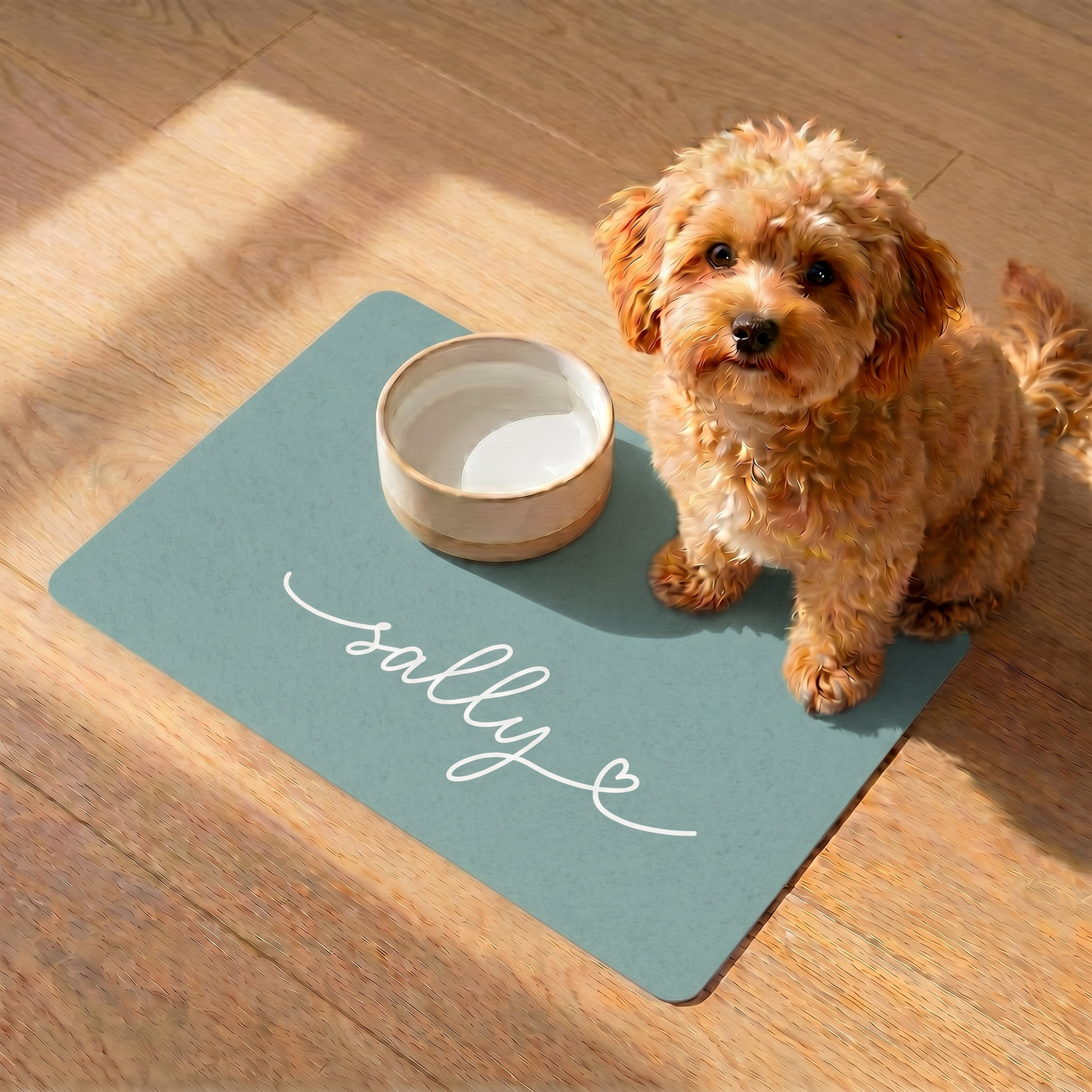 Close-up of handwritten name personalization on eucalyptus green dog food mat