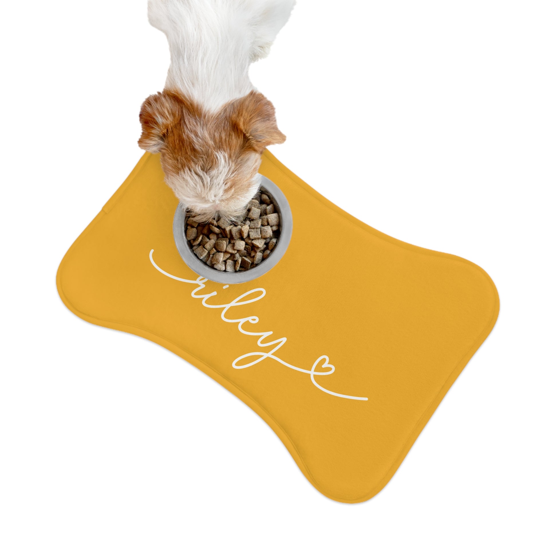 Personalized marigold dog food mat with kibble being poured into the bowl - lifestyle