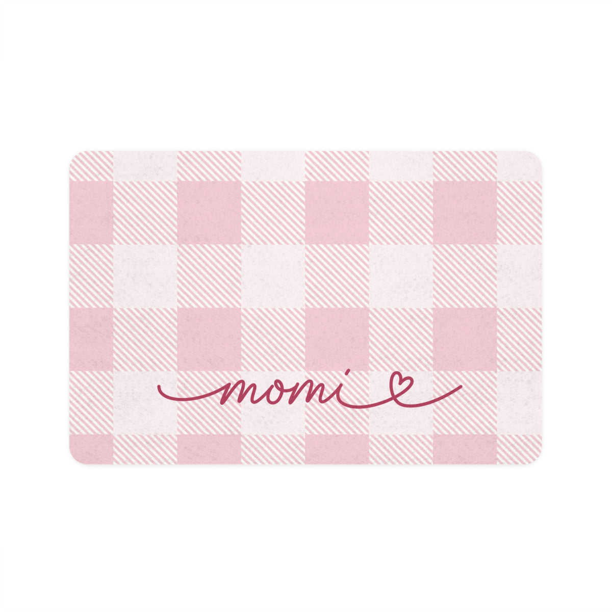 Pink gingham dog food mat with handwritten name, flat lay view