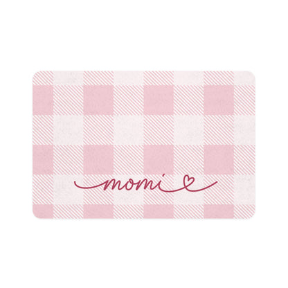 Pink gingham dog food mat with handwritten name, flat lay view