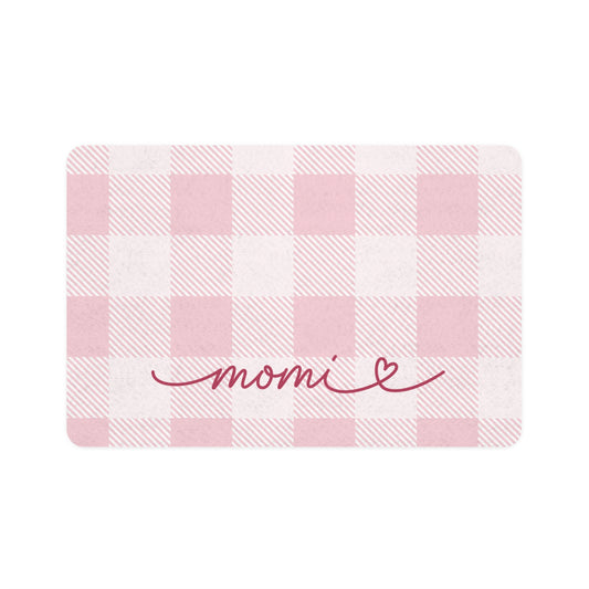 Pink gingham dog food mat with handwritten name, flat lay view