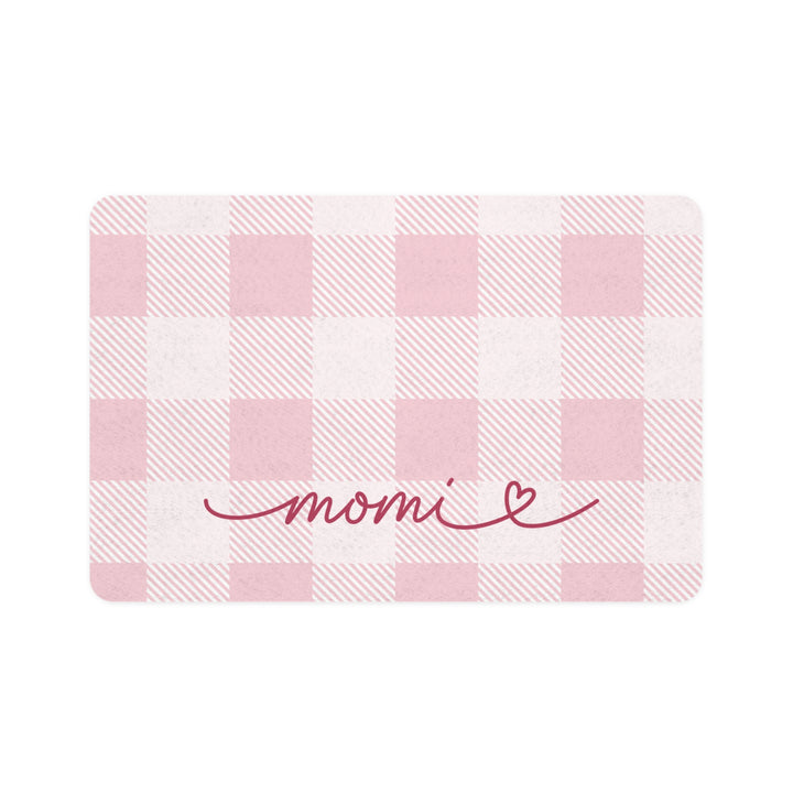 Pink gingham dog food mat with handwritten name, flat lay view