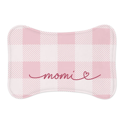 Pink checkered bone-shaped pet feeding mat with a name in red handwritten script and a heart