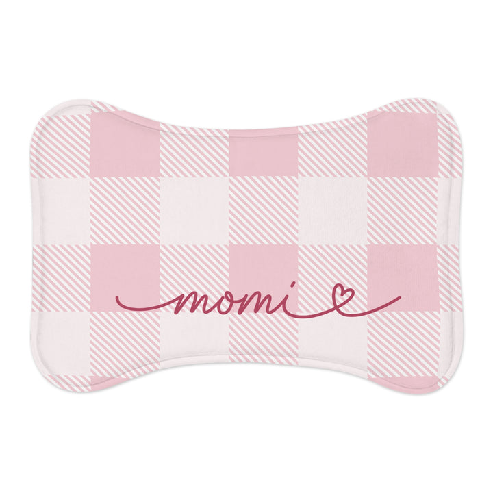 Pink checkered bone-shaped pet feeding mat with a name in red handwritten script and a heart